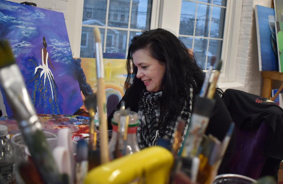 Artist Susan Drayton works in her studio space at SoCo Art Labs at 145 Globe St. in Fall River.