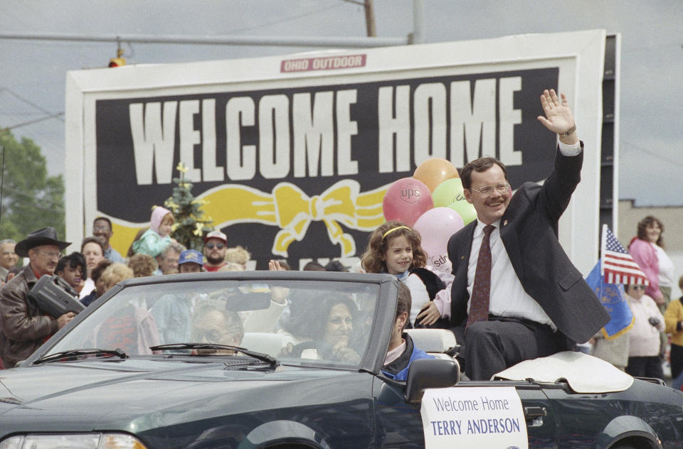 FILE - Former hostage Terry Anderson waves to the crowd as he rides in a parade in Lorain, Ohio, June 22, 1992. Fellow former hostages, family, and coworkers celebrated the life of journalist and philanthropist Terry Anderson, Wednesday, May 8, 2024, as a man who helped others while struggling to heal himself. (AP Photo/Mark Duncan, File)