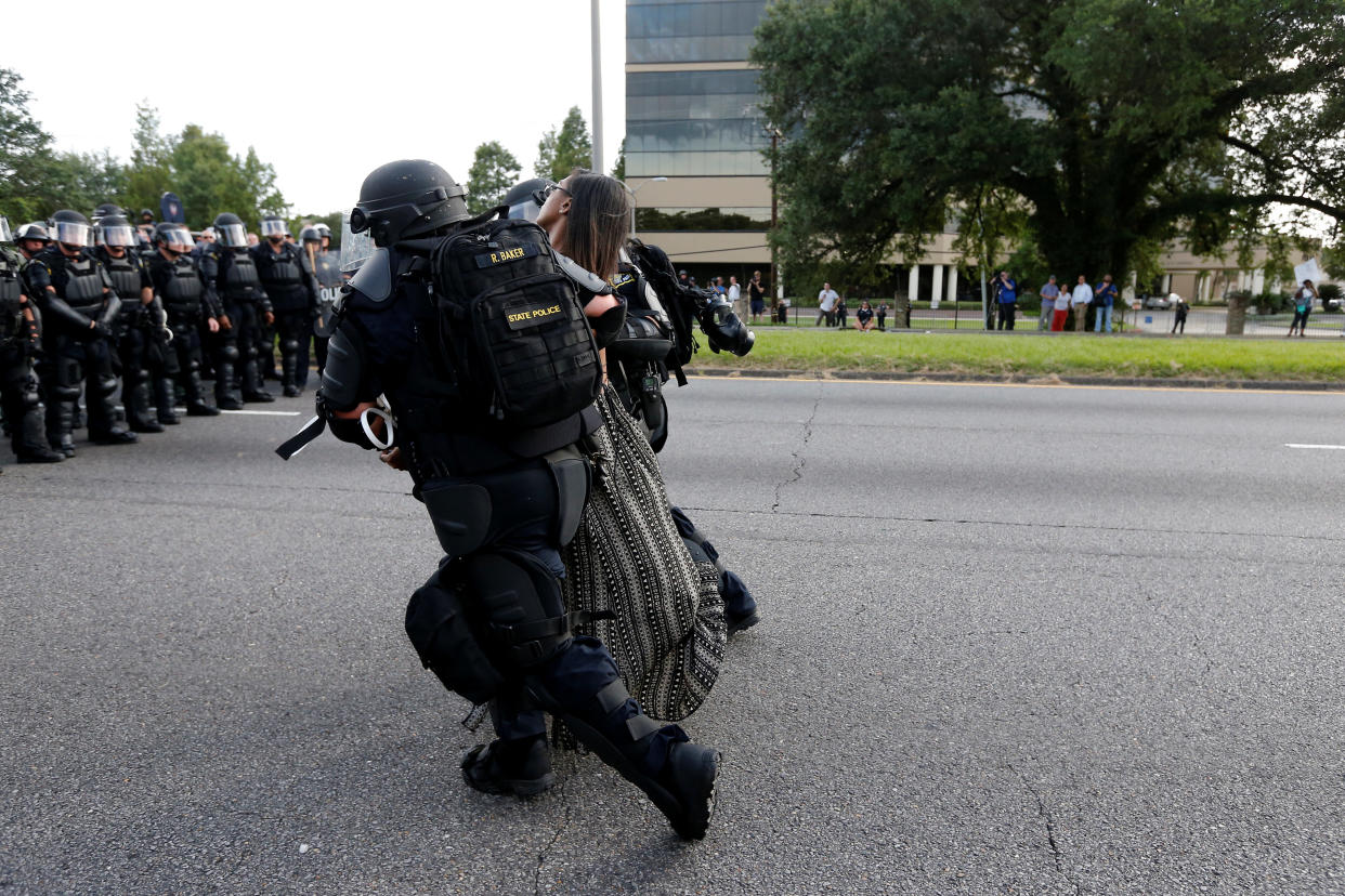 Protestor Ieshia Evans is detained by law enforcement near the headquarters of the Baton Rouge Police Department in Baton Rouge, Louisiana, U.S. July 9, 2016.    REUTERS/Jonathan Bachman          SEARCH "#BLACK LIVES MATTER" FOR THIS STORY. SEARCH "THE WIDER IMAGE" FOR ALL STORIES. 