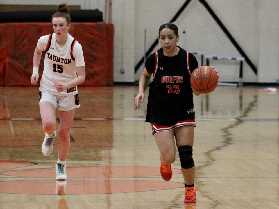 Durfee’s Jada Holley drives down court with Taunton’s Jillian Doherty in pursuit during a Taunton Holiday Classic preliminary round matchup.