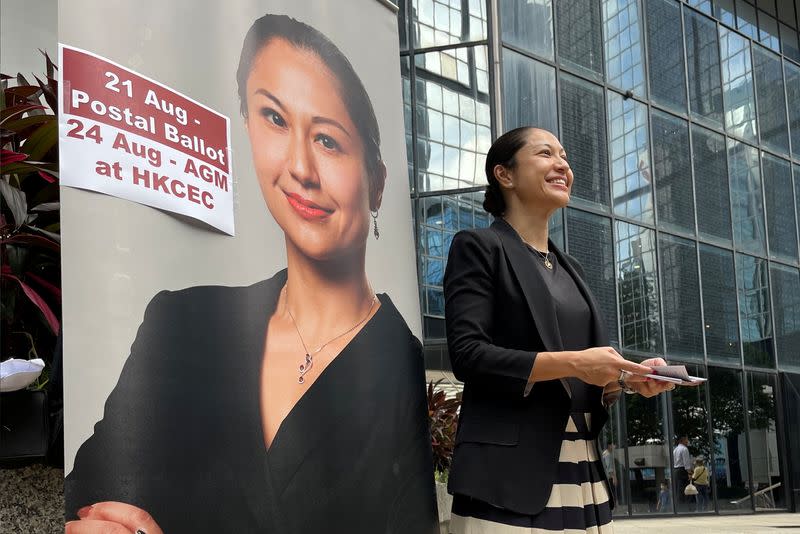 Selma Masood, candidate for Hong Kong Law Society's election, hands out pamphlets in Hong Kong