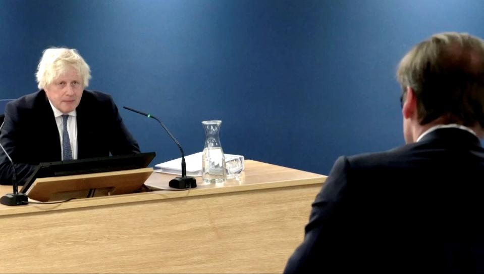 Former British Prime Minister Boris Johnson is questioned by Hugo Keith KC as he gives evidence at the Covid Inquiry in London on Thursday (via REUTERS)