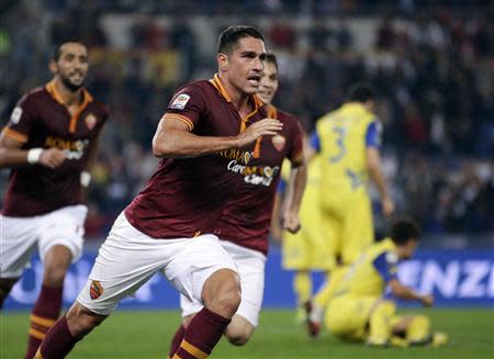 AS Roma's Marco Borriello celebrates after scoring against Chievo Verona during their Italian Serie A soccer match at the Olympic stadium in Rome October 31, 2013. REUTERS/Max Rossi