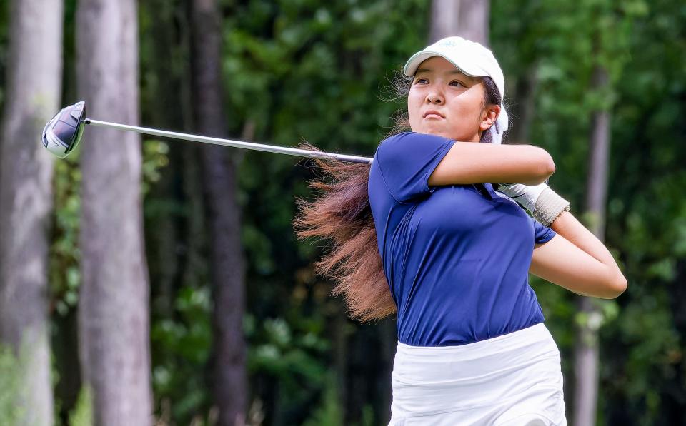 Hudson's Sherry Du eyes her shot at the Hudson Lady Explorer Invitational Monday at Lake Forest Country Club.