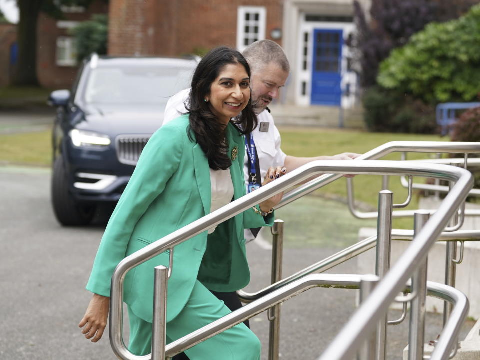 Home Secretary Suella Braverman with Chief Constable Tim Smith as she arrives for a visit to Kent Police headquarters in Maidstone, Kent, Britain, Tuesday, Sept 19, 2023, ahead of the announcement, where she has urged Meta not to roll out end-to-end encryption on its platforms without robust safety measures that ensure children are protected from sexual abuse and exploitation in messaging channels. (Gareth Fuller/PA via AP)