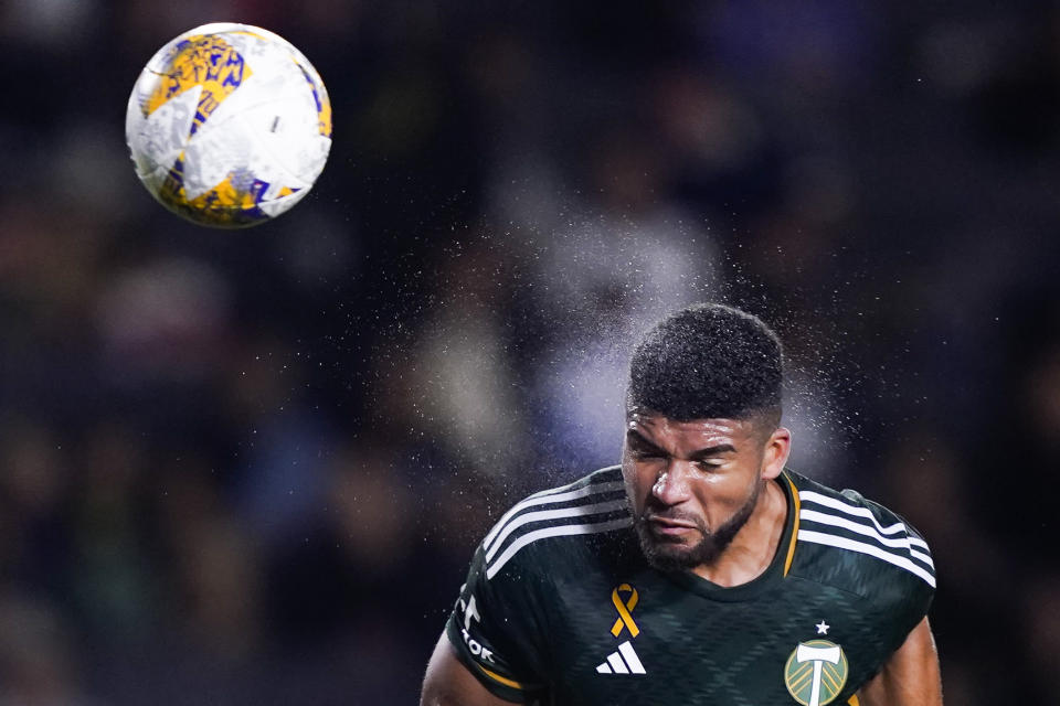 Portland Timbers defender Zac McGraw heads the ball, which was saved by LA Galaxy goalkeeper Jonathan Bond during the first half of an MLS soccer match Saturday, Sept. 30, 2023, in Carson, Calif. (AP Photo/Ryan Sun)