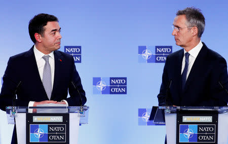 Macedonian Foreign Minister Nikola Dimitrov and NATO Secretary General Jens Stoltenberg hold a joint news conference after a signature ceremony of the accession protocol between the Republic of North Macedonia and NATO at the Alliance headquarters in Brussels, Belgium February 6, 2019. REUTERS/Francois Lenoir
