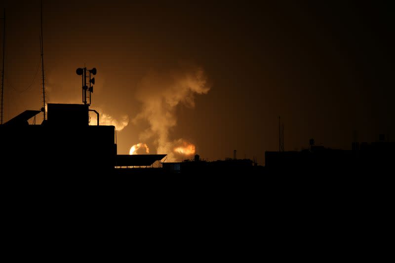 Flame and smoke are seen during an Israeli air strike in the southern Gaza Strip