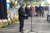 Pastor Albany Lee addresses congregants and community members on Saturday, May 21, 2022, as survivors and church leaders join in prayer and thank community members for their support nearly a week after a deadly shooting at a Taiwanese American church congregation in Laguna Woods, Calif. The community is reeling after the attack on a luncheon of the Irvine Taiwanese Presbyterian Church that killed one and wounded five. Lee said trauma specialists will be available to assist community members. (AP Photo/Amy Taxin)