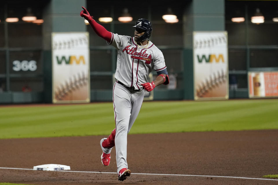 Atlanta Braves' Jorge Soler celebrates a three-run home run during the third inning in Game 6 of baseball's World Series between the Houston Astros and the Atlanta Braves Tuesday, Nov. 2, 2021, in Houston. (AP Photo/Eric Gay)