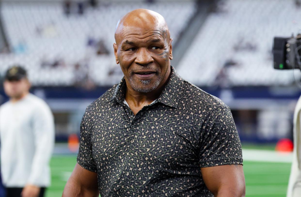 Mike Tyson is seen on the field before the game between the Dallas Cowboys and New Orleans Saints at AT&T Stadium.