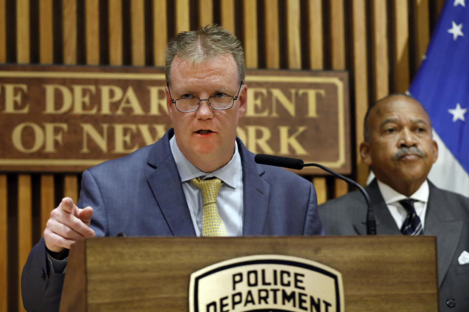 In this Oct. 24, 2019 file photo, Deputy Chief Kevin Maloney speaks during a news conference at police headquarters in New York. The NYPD says it has confirmed that an officer who was saved by his bulletproof vest was hit by a suspect's bullet, during a confrontation with the apparently emotionally disturbed man early Oct. 23 at a Harlem apartment building. At right is First Deputy Police Commissioner Benjamin Tucker. A surge in violent police clashes in recent weeks has left a trail of bodies across the city and stoked tensions between officers and critics who say they have been too quick to use deadly force. (AP Photo/Richard Drew, File)