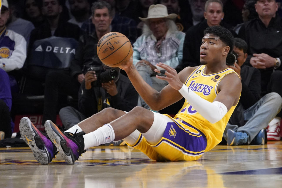 Los Angeles Lakers forward Rui Hachimura tries to pass after grabbing a loose ball during the first half of an NBA basketball game against the San Antonio Spurs Wednesday, Jan. 25, 2023, in Los Angeles. (AP Photo/Mark J. Terrill)