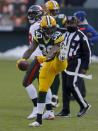 Green Bay Packers' Jamaal Williams (30) celebrates during the first half of the NFC championship NFL football game against the Tampa Bay Buccaneers in Green Bay, Wis., Sunday, Jan. 24, 2021. (AP Photo/Jeffrey Phelps)