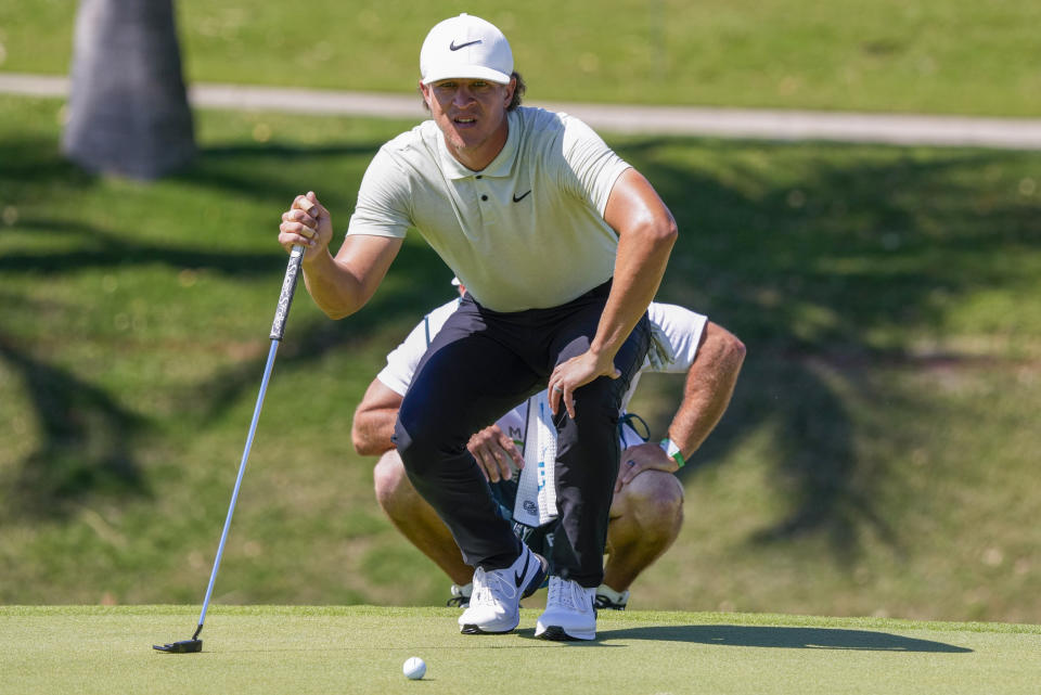 Cameron Champ, of the United States, studies his putt at the 5th green during the first round of the Mexico Open golf tournament in Puerto Vallarta, Mexico, Thursday, Feb. 22, 2024. (AP Photo/Fernando Llano)