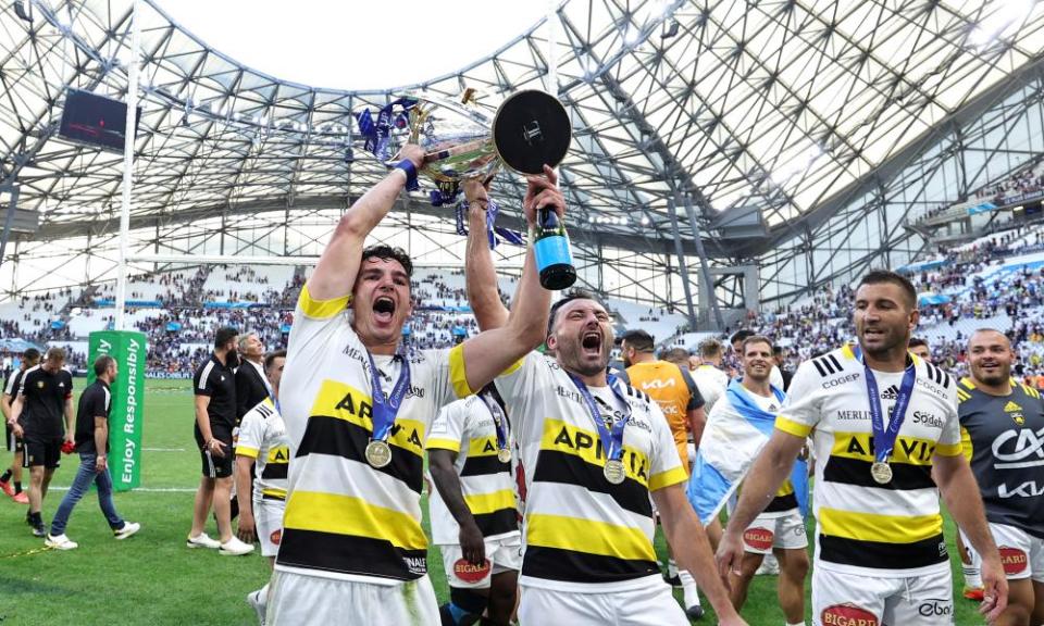 La Rochelle players celebrate with the trophy after winning last season’s Champions Cup