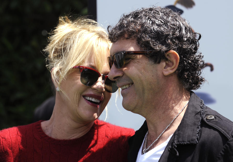 Cast member Antonio Banderas (R) and wife Melanie Griffith attend the premiere of the film "Shrek Forever After" in Los Angeles May 16, 2010. REUTERS/Phil McCarten (UNITED STATES - Tags: ENTERTAINMENT SOCIETY)