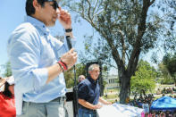 California senate president pro tem Kevin de Leon, (L), and environmental activist Robert F. Kennedy Jr. look out at the crowd during the People's Climate March protest for the environment in the Wilmington neighborhood in Los Angeles, California, U.S. April 29, 2017. REUTERS/Andrew Cullen