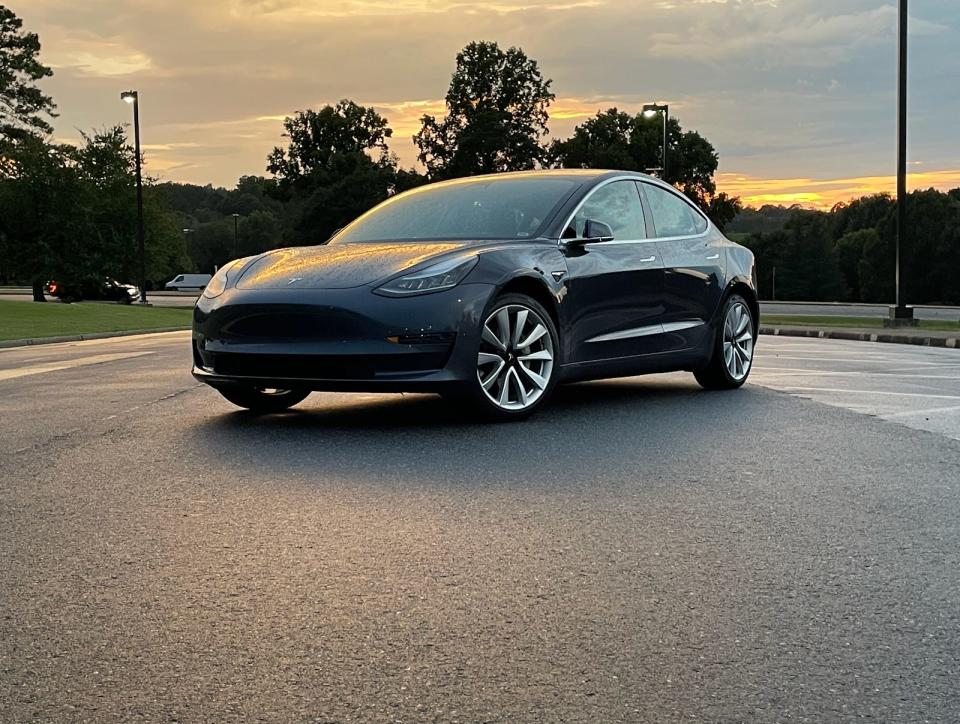 a Tesla Model 3 in the sunlight