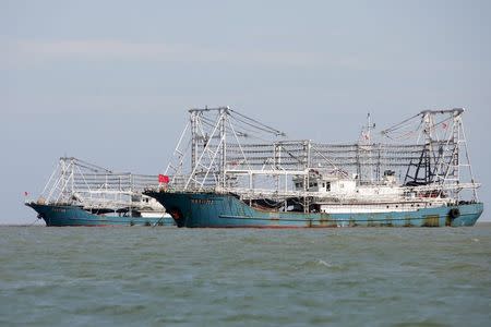 Boat 11202 cruises past in the city of Dongfang on the western side of China's island province of Hainan, June 18, 2014. REUTERS/John Ruwitch