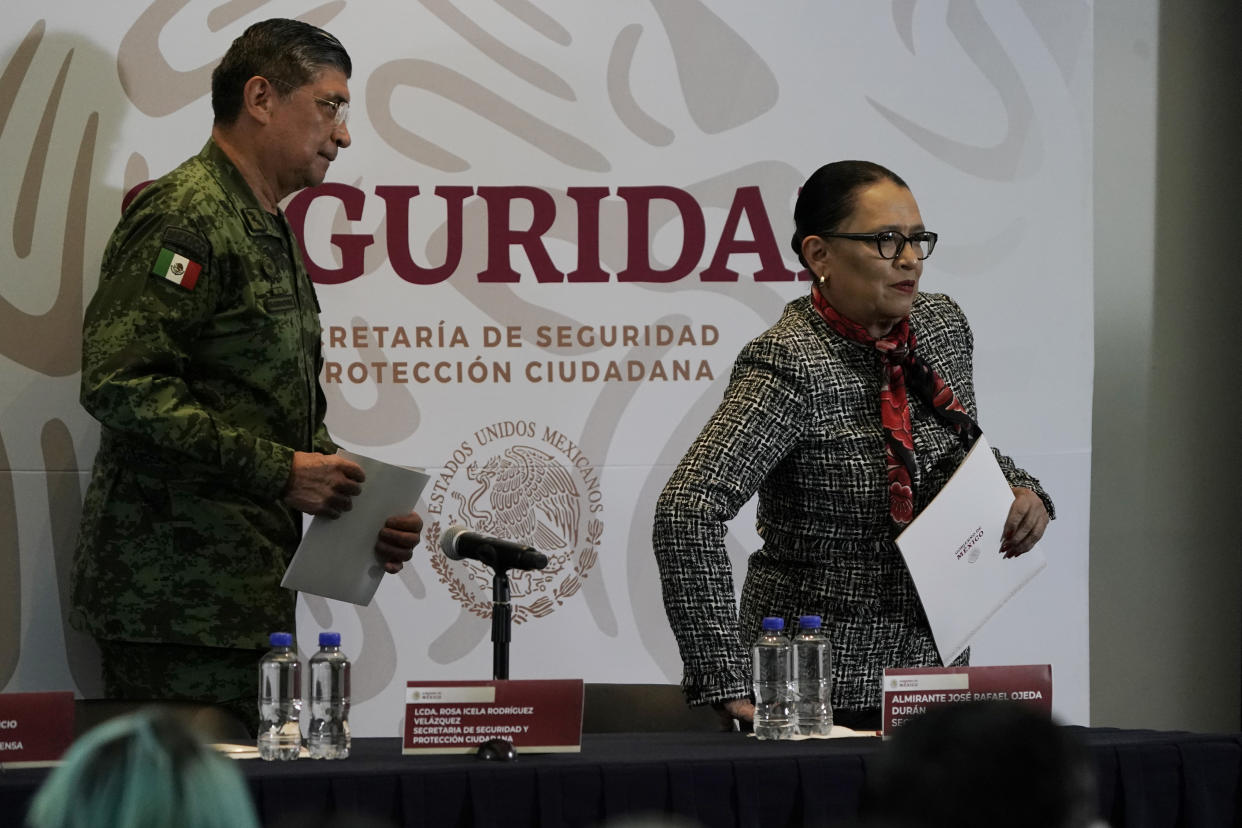 Mexican Public Safety Secretary Rosa Icela Rodriguez, right, and Mexican Defense Secretary Luis Cresencio Sandoval leave after a news conference announcing the arrest of Ovidio in Mexico City, Thursday, Jan. 5, 2023. Mexican security forces captured Ovidio Guzmán, an alleged drug trafficker wanted by the United States and one of the sons of former Sinaloa cartel boss Joaquín "El Chapo" Guzmán, Thursday in a pre-dawn operation outside Culiacan. (AP Photo/Eduardo Verdugo)