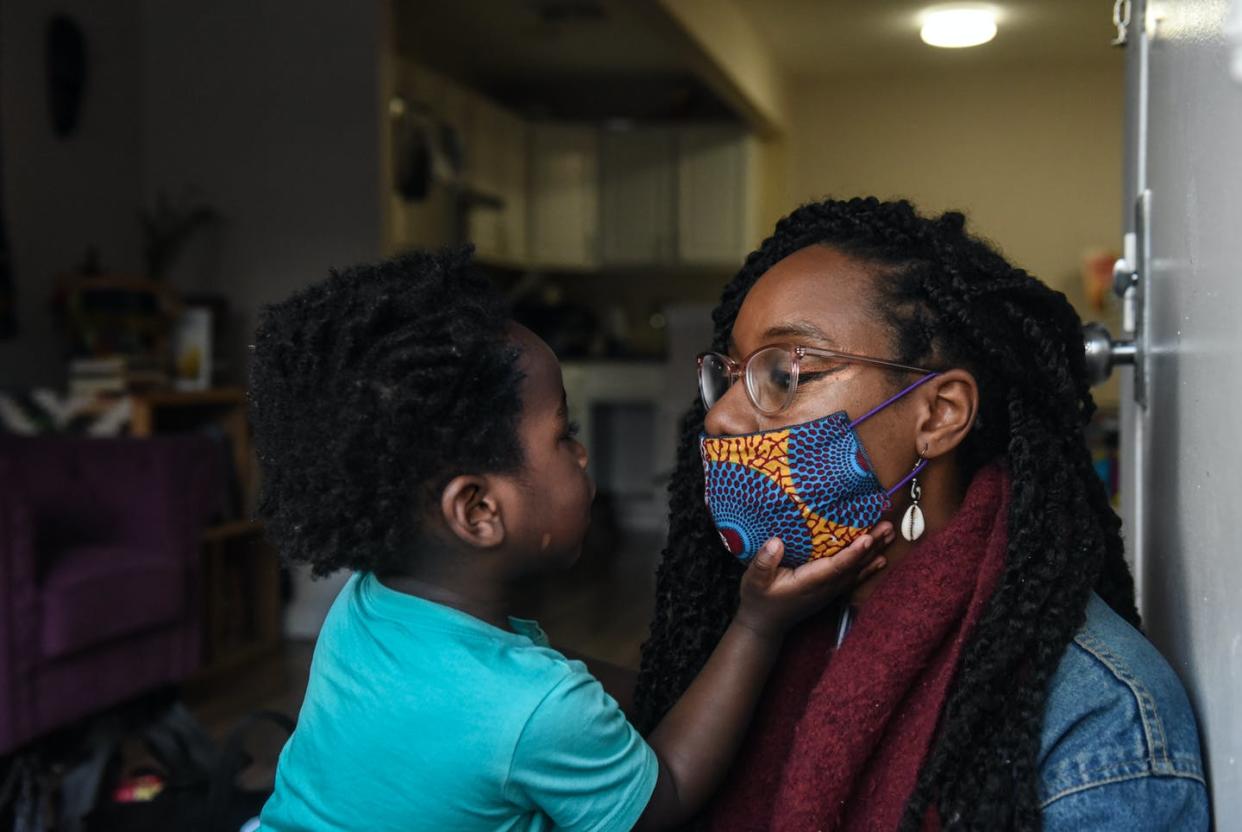 <span class="caption">Sevonna Brown of Black Women's Blueprint, a mutual aid group, with her son in Brooklyn, New York. Mutual aid groups have been formed across New York City to address the economic plight caused by COVID-19. </span> <span class="attribution"><a class="link " href="https://www.gettyimages.com/detail/news-photo/sevonna-brown-of-black-womens-blueprint-a-mutual-aid-group-news-photo/1212730608?adppopup=true" rel="nofollow noopener" target="_blank" data-ylk="slk:Stephanie Keith via Getty Images;elm:context_link;itc:0;sec:content-canvas">Stephanie Keith via Getty Images</a></span>