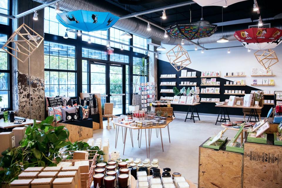 large store with candles, books, card, and pillows