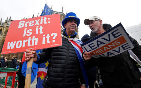 Anti-Brexit protestor Steve Bray (L) remonstrates with a pro-Brexit protestor outside of the Houses of Parliament, in London, Britain, December 10, 2018. REUTERS/Toby Melville