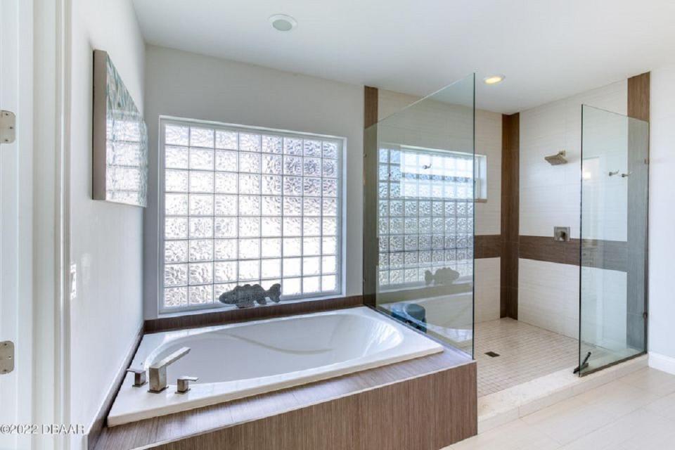 The spa-like main suite bathroom is an example of the modern detail in this two-story home.