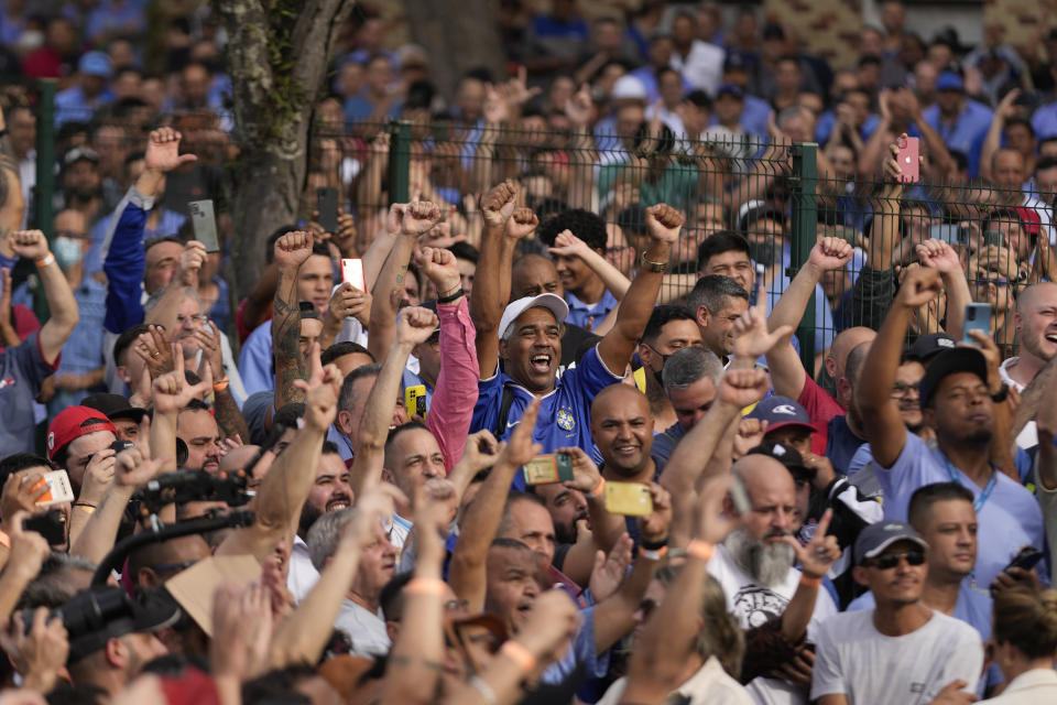 Supporters of Brazil's former President Luiz Inacio Lula da Silva, who is running for reelection, cheer during a campaign rally outside the Volkswagen automaker´s plant in Sao Bernardo do Campo, greater Sao Paulo area, Brazil, Tuesday, Aug. 16, 2022. Brazil's general elections are scheduled for Oct. 2, 2022. (AP Photo/Andre Penner)