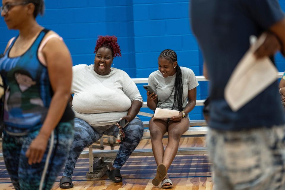 Ariyana Sharpe, right, 21, of Detroit, shares a laugh with her mother, Alicia Sharpe, of Detroit, after Ariyana passed her test to get her driver's permit during the Road to Restoration program clinic held at LA SED Senior and Youth Center in southwest Detroit on Tuesday, June 18, 2024. 