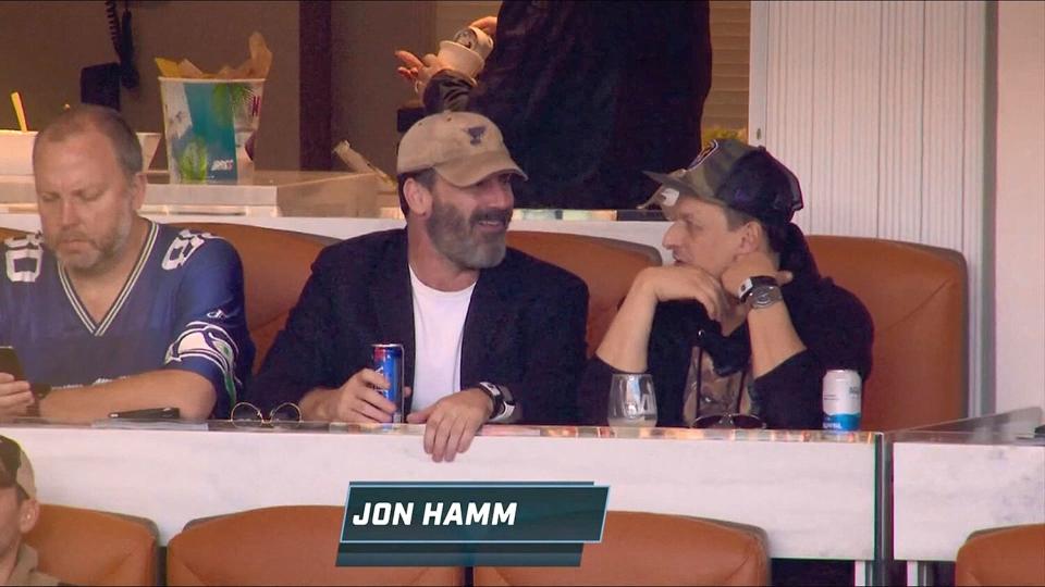 Hamm kicked back while watching the game with pals. 