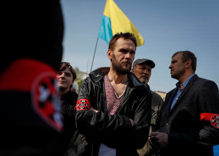 Activists attend a rally to demand lawmakers vote for a law that grants special status to the Ukrainian language and introduces mandatory language requirements for public sector workers, in front of the parliament building in Kiev, Ukraine April 25, 2019. REUTERS/Gleb Garanich