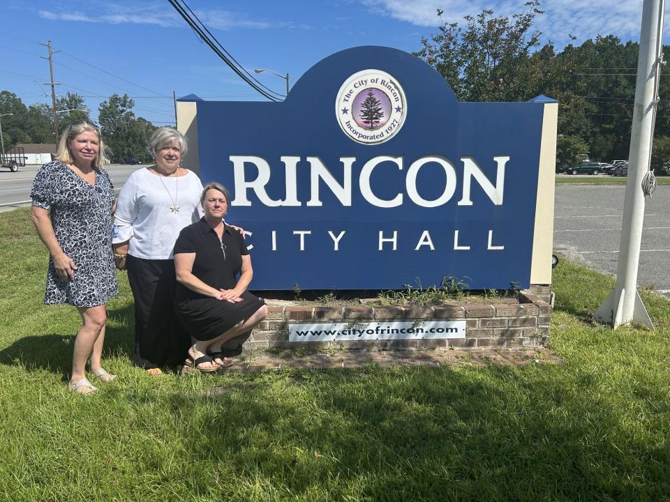 From left: City council member Michelle Taylor poses for a photograph alongside city council hopefuls Mona Underwood and Brandy Riley.