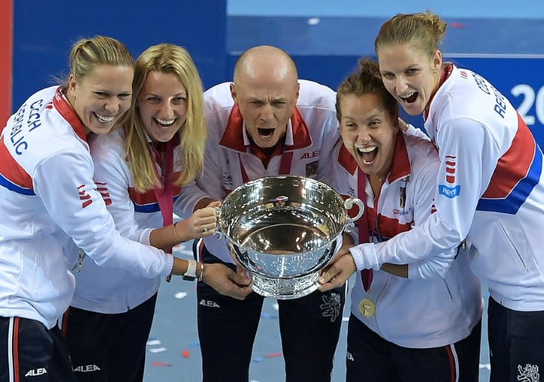 Czech Republic's players pose with the trophy after winning the Fed Cup final against France in Strasbourg, eastern France, on November 13, 2016