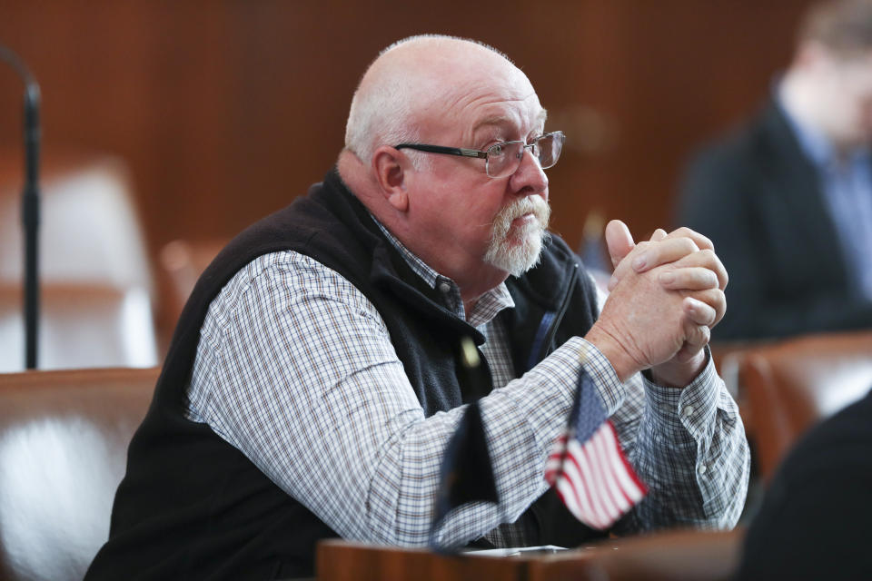 Returning from two unexcused absences, Republican state Sen. Lynn Findley sits at his desk during a Senate session where other unexcused absences prevented a quorum for the third day at the Oregon State Capitol in Salem, Ore., Friday, May 5, 2023. Four Republican senators and one Independent senator had unexcused absences. (AP Photo/Amanda Loman)