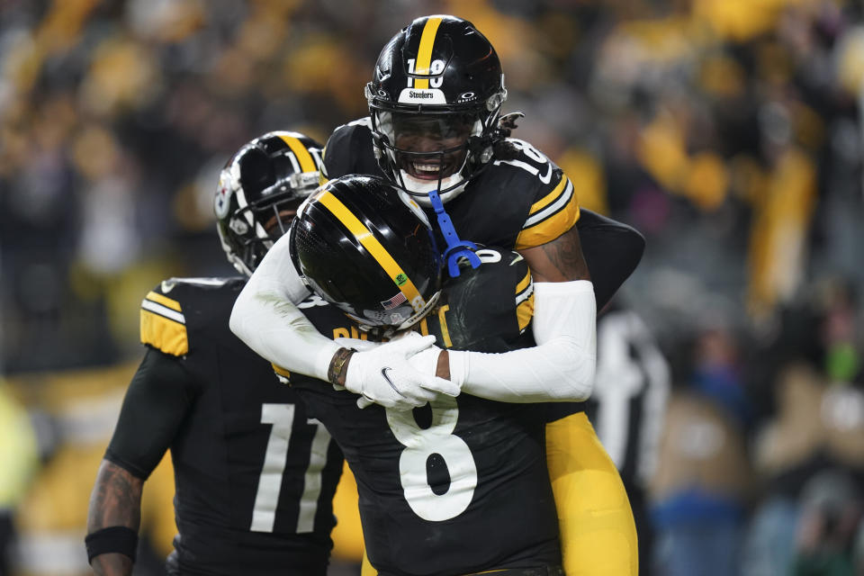 Pittsburgh Steelers wide receiver Diontae Johnson (18) and quarterback Kenny Pickett (8) celebrate a touchdown against the Tennessee Titans during the second half of an NFL football game Thursday, Nov. 2, 2023, in Pittsburgh. (AP Photo/Matt Freed)
