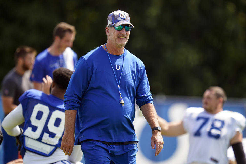 Indianapolis Colts head coach Frank Reich walks through stretching during practice at the NFL team's football training camp in Westfield, Ind., Monday, Aug. 8, 2022. (AP Photo/Michael Conroy)