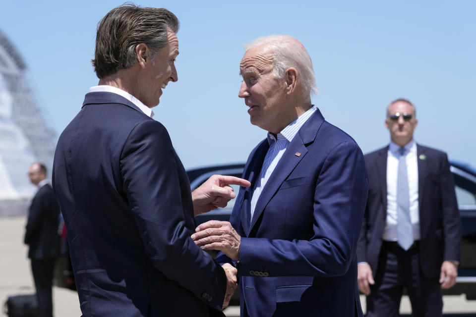 FILE - President Joe Biden shakes hands with California Gov. Gavin Newsom as he arrives at Moffett Federal Airfield, Calif., Monday, June 19, 2023. (AP Photo/Susan Walsh, File)