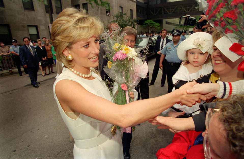 View of Diana, Princess of Wales (1961 - 1998), a bouquet in her hands, as she greets onlookers during a visit to Northwestern Hospital, Chicago, Illinois, June 6, 1996. (Photo by Steve Kagan/Getty Images)