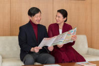 Japan's Crown Prince Naruhito (L) and Japan's Crown Princess Masako read a leaflet about this year's Disability Awareness Week at their residence in Tokyo, in this handout picture taken by Imperial Household Agency of Japan on December 5, 2017. REUTERS/Imperial Household Agency of Japan/Handout via Reuters.