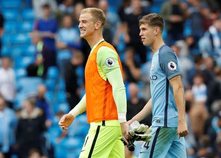 Football Soccer Britain - Manchester City v West Ham United - Premier League - Etihad Stadium - 28/8/16 Manchester City's Joe Hart and John Stones celebrate after the match Reuters / Darren Staples Livepic