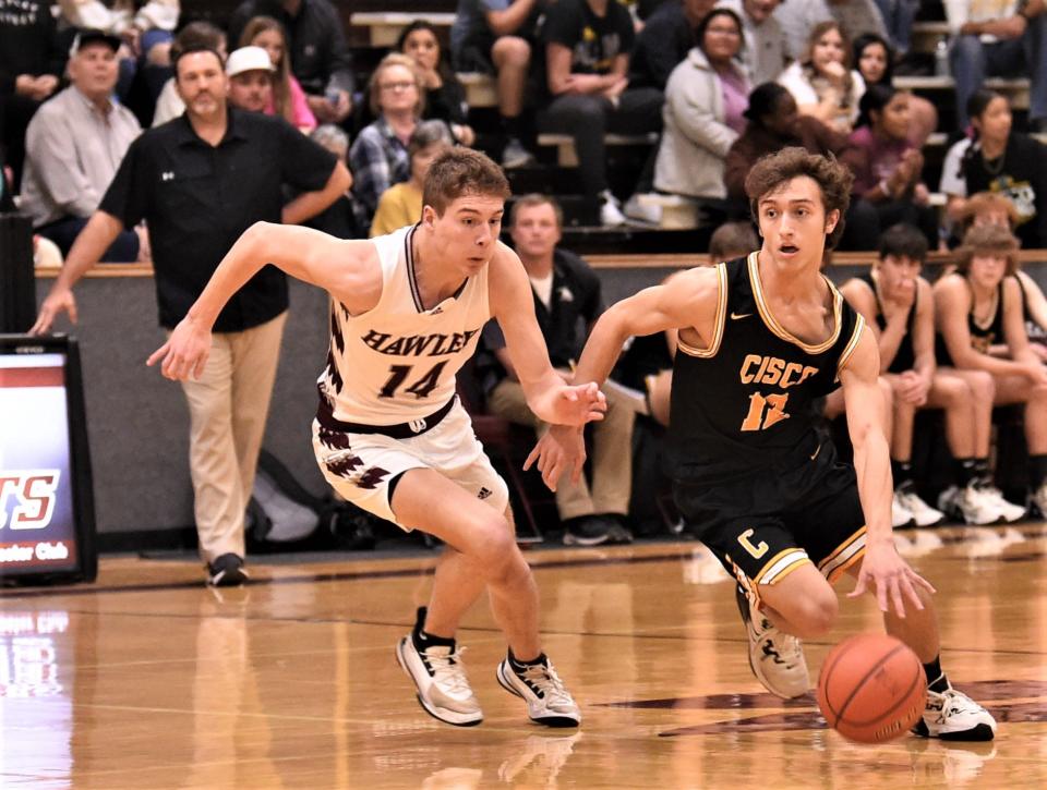 Cisco's Gavin Landenberger, right, tries to get around Hawley's Kason O'Shields in the first half. Hawley beat the Loboes 65-51 in the District 10-2A game Monday, Feb. 6, 2023, at Hawley.