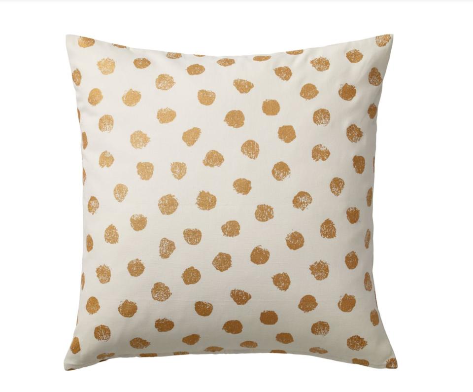 This 20 x 20 square cushion cover has a playful golden pattern. <strong><a href="https://fave.co/30xSiBi" target="_blank" rel="noopener noreferrer">Find it for $7 at IKEA</a>.</strong>