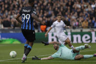 Fiorentina's goalkeeper Pietro Terracciano, right, reaches out for a save during an attempt by Brugge's Igor Thiago during the Europa Conference League semi-final second leg soccer match between Club Brugge and Fiorentina at the Jan Breydel Stadium in Bruges, Belgium, Wednesday, May 8, 2024. (AP Photo/Omar Havana)