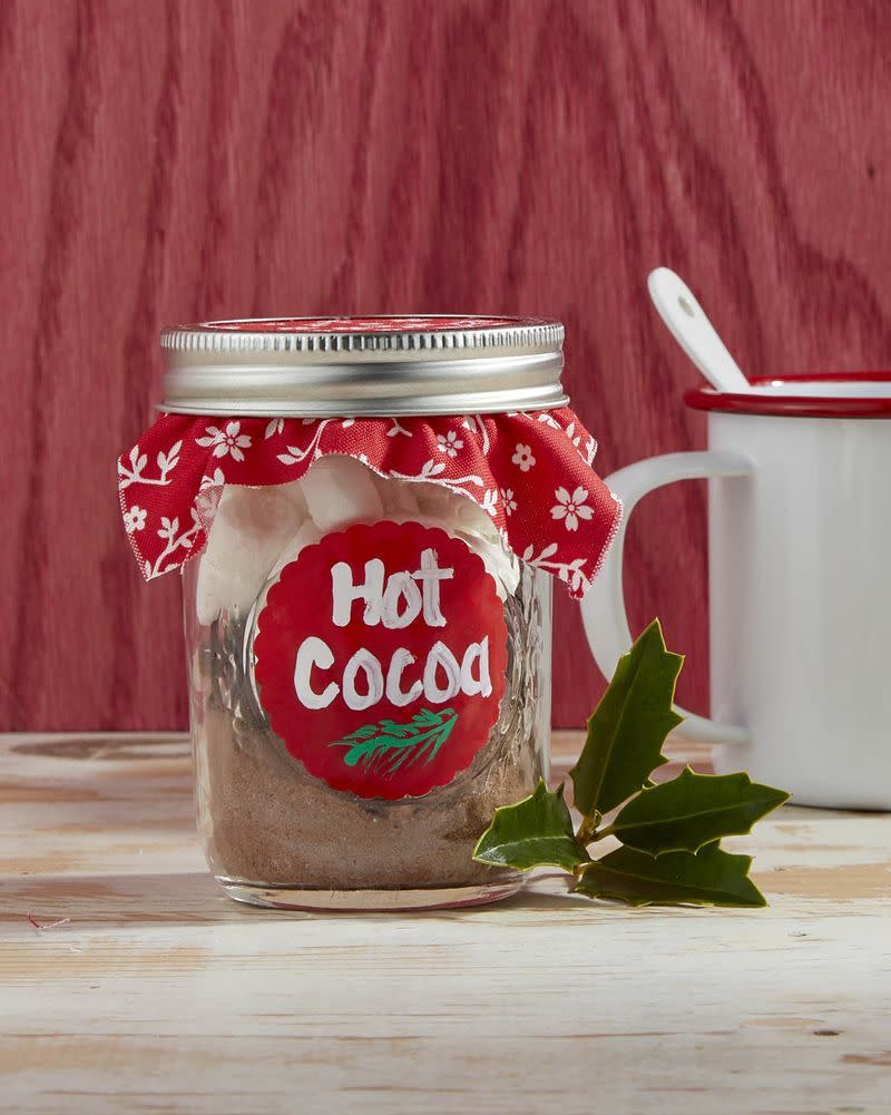 <p>We can guarantee that you’ll have to make the kids a cup of hot cocoa when you recruit them to help assemble these sweet DIY kits. But spending quality time making gifts for loved ones will be worth the sugar rush.</p><p><strong>To make:</strong> Paint a red circle with acrylic paint (or use a round red sticker) on a 1-cup mason jar. Once dry paint on a bit of greenery and write <em>hot cocoa</em>. Layer hot cocoa mixture, chocolate chips, and mini marshmallows in the jar. Place a square of seasonal fabric between the lid and screw band and tighten.</p><p><a class="link " href="https://www.amazon.com/Regular-Airtight-Storage-Drinking-Overnight/dp/B08511BW21/ref=sr_1_2?tag=syn-yahoo-20&ascsubtag=%5Bartid%7C10050.g.5030%5Bsrc%7Cyahoo-us" rel="nofollow noopener" target="_blank" data-ylk="slk:SHOP MASON JARS">SHOP MASON JARS</a></p>
