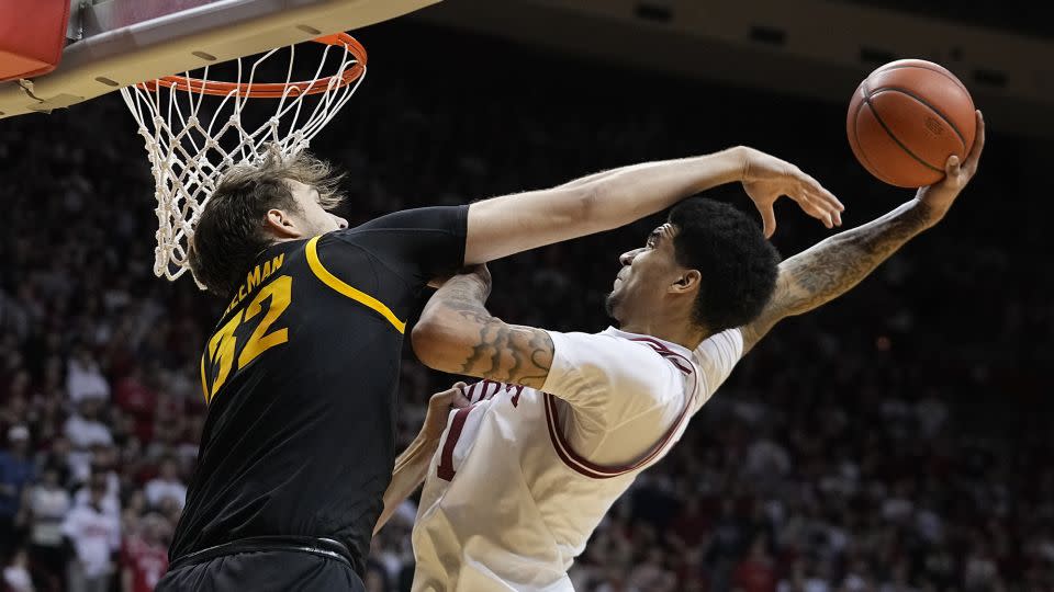 Indiana's Kel'el Ware dunks on Iowa's Owen Freeman in an NCAA basketball game on January 30 in Bloomington, Indiana. - Darron Cummings/AP