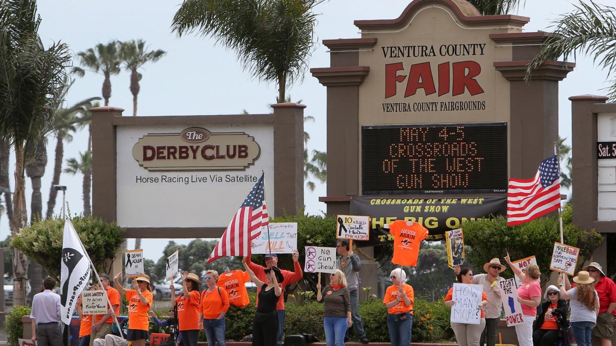 A 2019 Crossroads of the West gun show at the Ventura County Fairgrounds drew protesters. The shows were banned but now Crossroads is asking to bring them back.