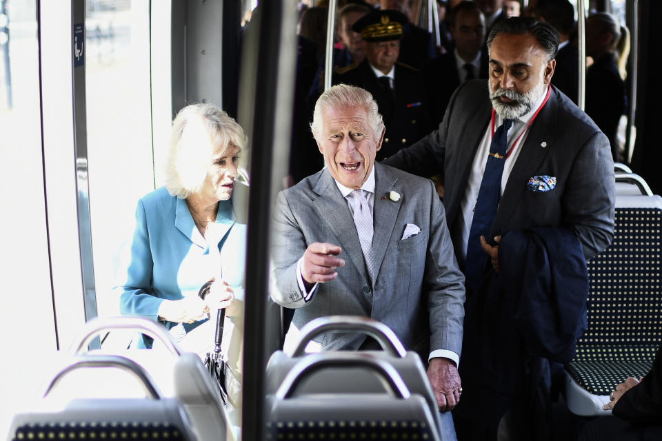 Britain's King Charles III and Queen ride Bordeaux' s electric tram in Bordeaux, southwestern France, Friday Sept. 22, 2023. Britain's King Charles III traveled to Bordeaux on the third day of his state visit to France to focus on climate and the environment. (Christophe Archambault, Pool via AP)