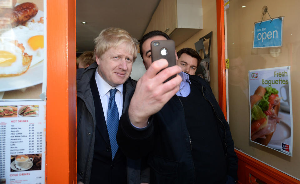 Mayor of London Boris Johnson has a selfie taken with a member of the public after launching the Conservative London campaign at Hartley Hall in Mill Hill, London.